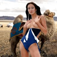 beautiful-kazakhstani-girl-posing-topless-swimwear-with-camel